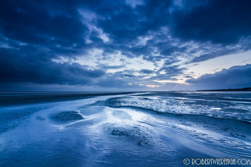 's Ochtends op het strand