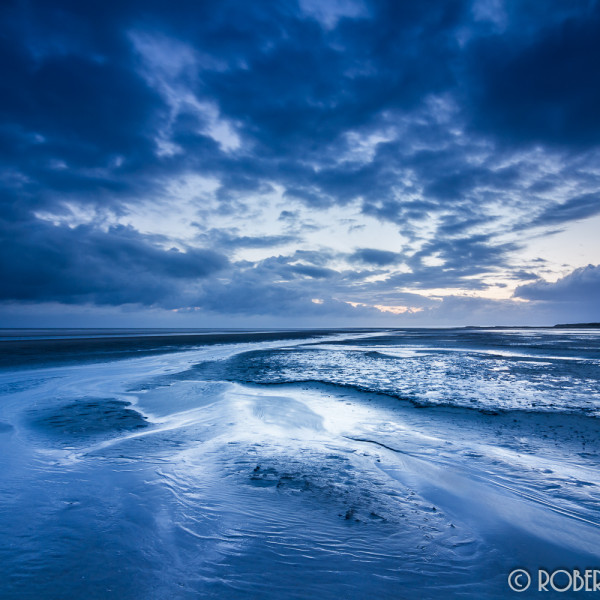 's Ochtends op het strand